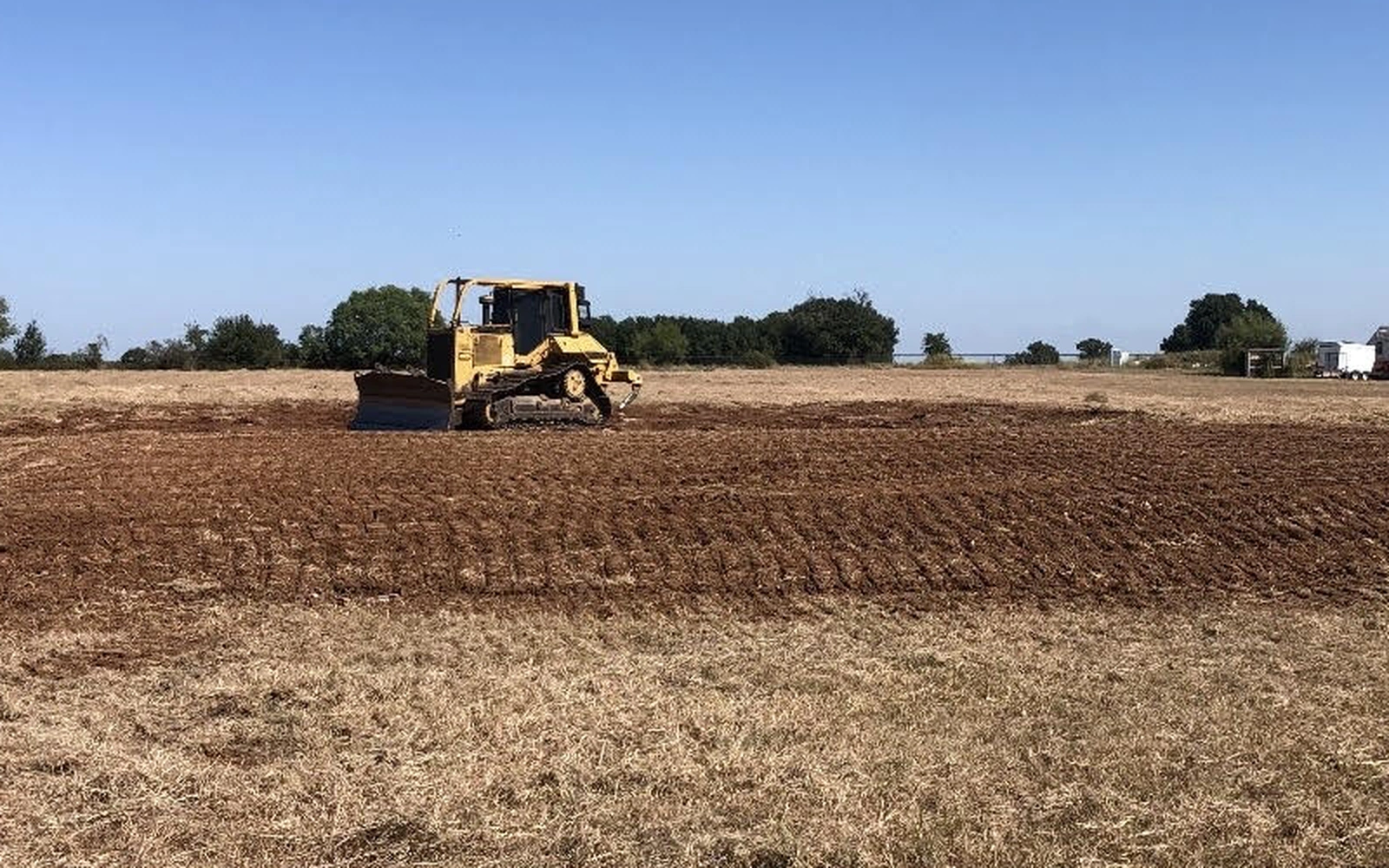 Precision grading and compaction for a structural house pad in Central Texas